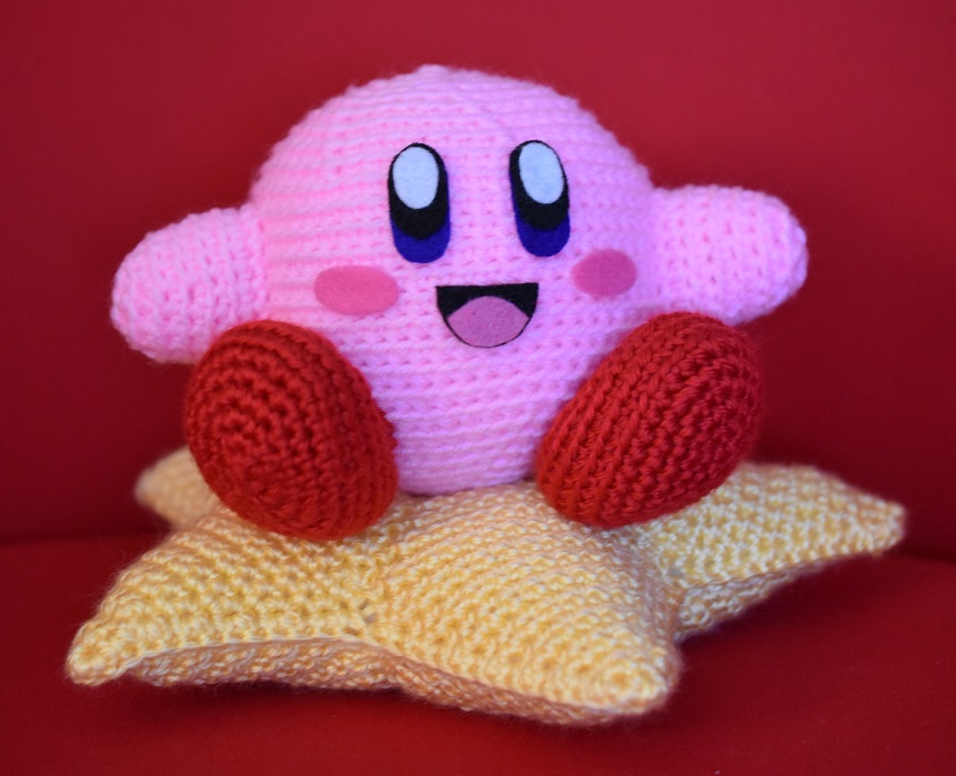 Amigurumi Kirby with crocheted star pillow